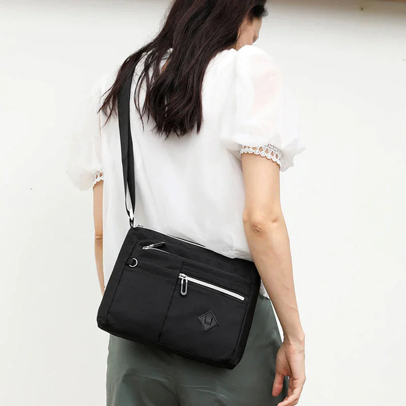 Lightweight multi-pocket shoulder bag for both men and women