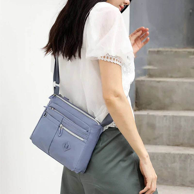 Lightweight multi-pocket shoulder bag for both men and women